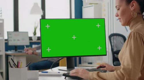 Close Up of Woman Using Computer with Isolated Green Screen