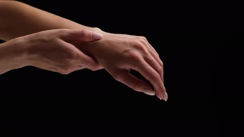 Adult Hand Holding Wrist Massaging in Close Up