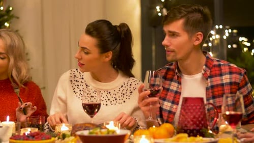 Friends Celebrating Christmas Dinner Together
