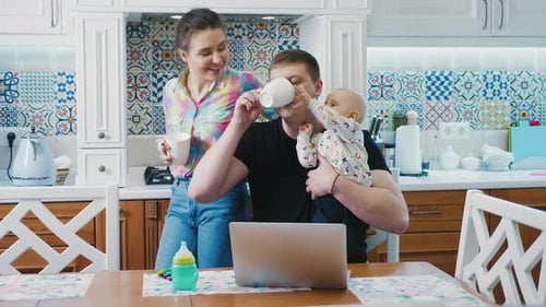 Family Working From Home With Baby