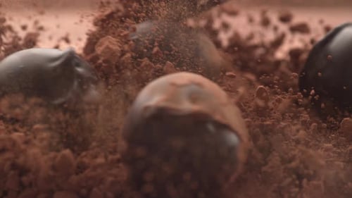 Chocolate Balls Rolling in Cocoa Powder Close Up