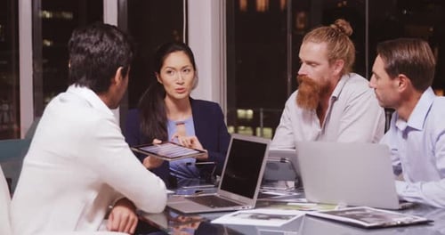 Team Meeting Late at Night in Modern Office