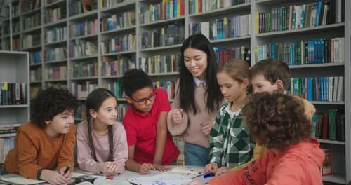Asian Teacher and Children Rejoice After Completing Project
