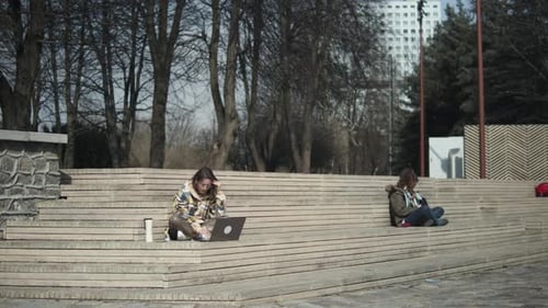 Young Adults Using Technology in Urban Park