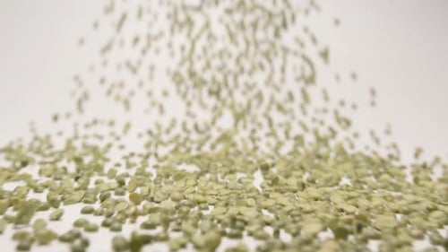 Stream Of Dried Green Peas Moving To A Camera