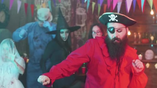 People in Costumes Dancing at a Halloween Party
