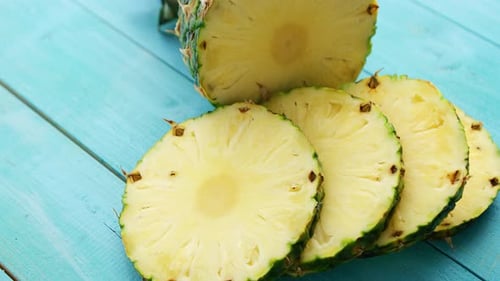 Sliced Fresh Pineapple on Blue Background