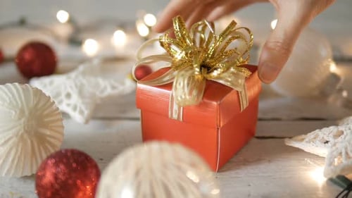 Gift Placed among Festive Christmas Ornaments