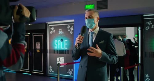 Man Announcing Sale at Store Opening