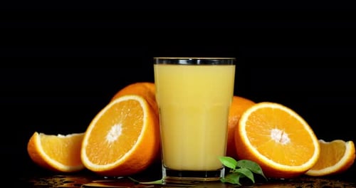 Refreshing Orange Juice and Sliced Oranges