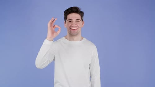 Smiling Man Makes OK Hand Gesture