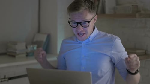 Man Works Late and Celebrates Success