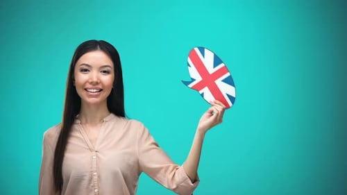 Young Woman Holding Union Jack Speech Bubble Smiling