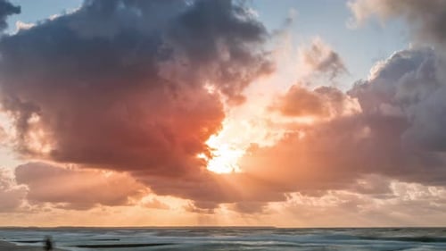 Beautiful sunset on the sea with smooth waves