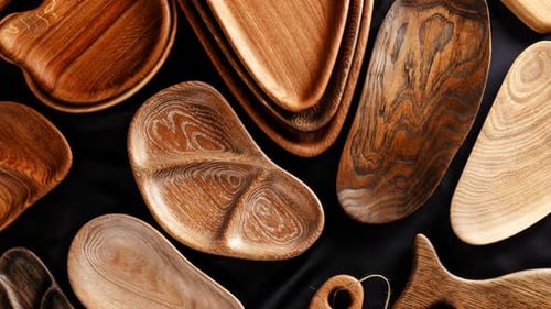 Artistic Wood Plates and Serving Boards Displayed