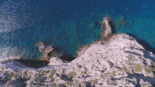 Transparent sea water near stony remote coast