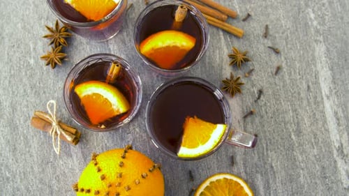 Glasses of Hot Mulled Wine with Orange and Spices