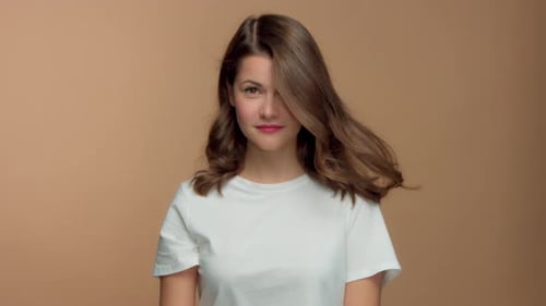 Monochrome Natural Makeup Look Caucasian Woman in Studio with Brunette Wavy Hair Blowing