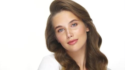 Young Woman Posing Gracefully With Brown Hair