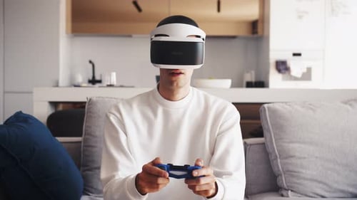 Young Adult Gaming with VR Headset at Home