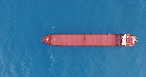 Freight Ship Floating on Sea. Aerial View.