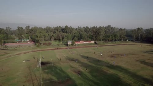 Aerial View of Soccer Practice on Urban Field