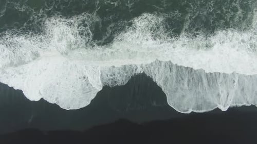 Ocean Crashing Waves. Reynisfjara Black Beach, Iceland. Aerial Top-Down View