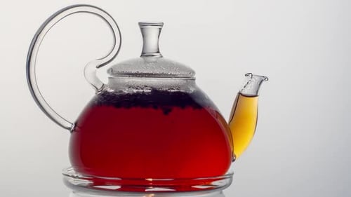 Close Up of Tea Brewing. Tea Leaves with Boiling Water