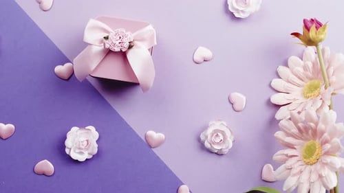 Gift Box With Flowers on Pink Background