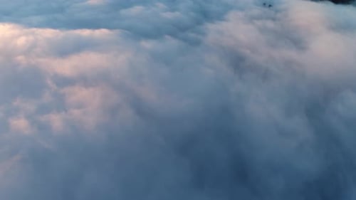 Aerial View of Fluffy Clouds at Sunrise or Sunset