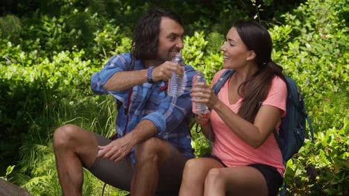 Hikers Taking a Break in Sunny Wilderness