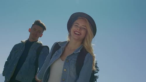 Smiling Couple Walking Together on Sunny Day