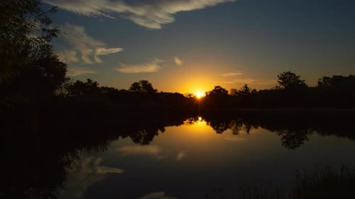 Tranquil Sunrise Over Lake Time Lapse Zoom Out