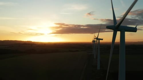 Wind Turbines Spinning at Golden Sunset