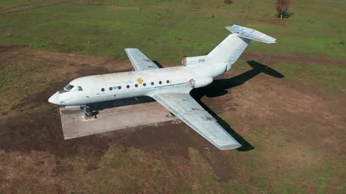 Abandoned Plane at the Airport on Green Grass