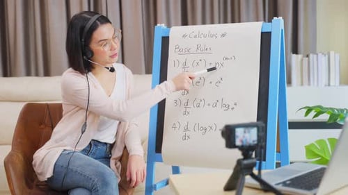 Asian school young woman teacher working from home teach remote online math subject to student.