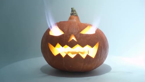 Smoking Carved Pumpkin for Halloween
