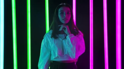 Stylish Woman Posing in Vibrant Neon Lighting