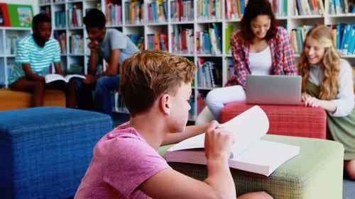 School kids doing homework in library