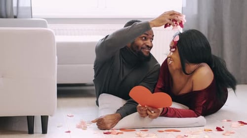 Loving Couple Celebrates with Rose Petals and Heart