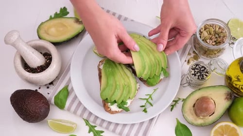 Preparing Delicious Avocado Toast with Fresh Ingredients