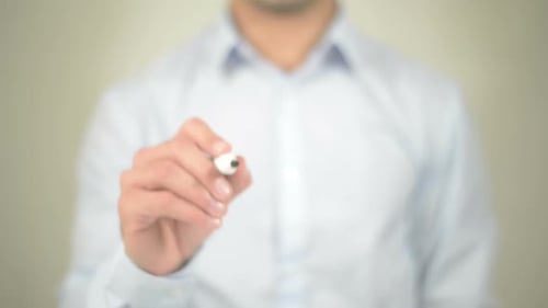 Man Writing the Word WOW With a Marker