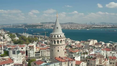 Slowly Circling Around Galata Tower in Istanbul, Turkey with View Over Skyline and Bosphorus, Slow