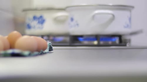Eggs and Pots on Stove