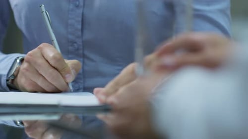 Closeup of Male Hands Sighing Business Agreement