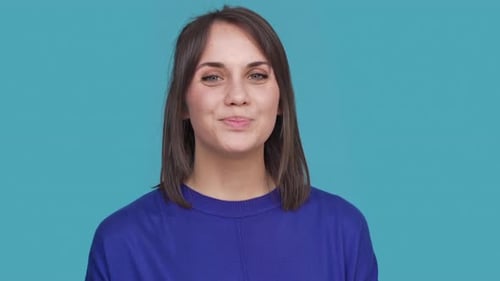 Portrait of Cute Woman Smiling with White Perfect Teeth Saying Yes and Nodding Positively Meaning