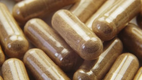 Pills Capsules with Biologically Active Additives Rotation Macro Shot