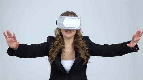 Woman Using Virtual Reality Headset in Studio