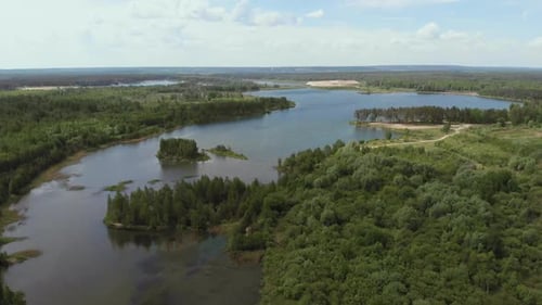 Aerial View. Flying Camera Over Beautiful Lakes and Green Forests. Flying Over the Beautiful Lake