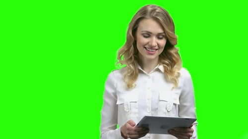 Woman Using Tablet on Green Screen
